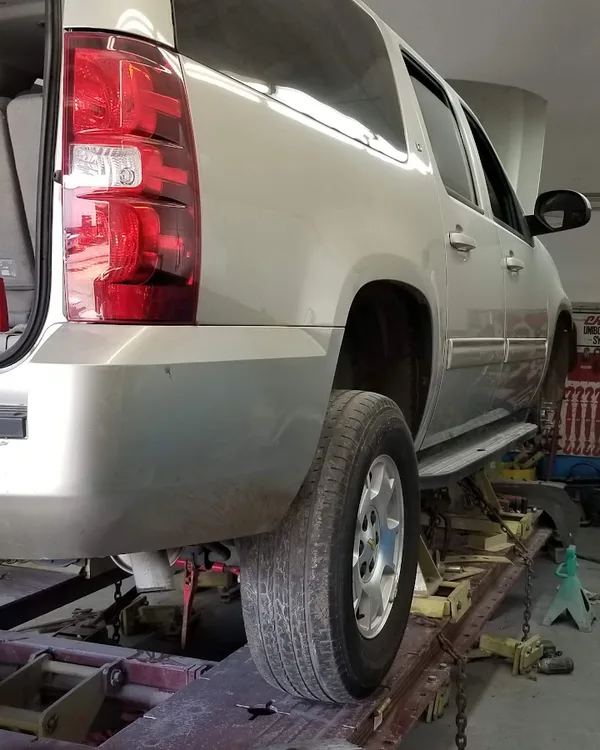 Cadillac Escalade on the frame machine in the SV Collisions service bay