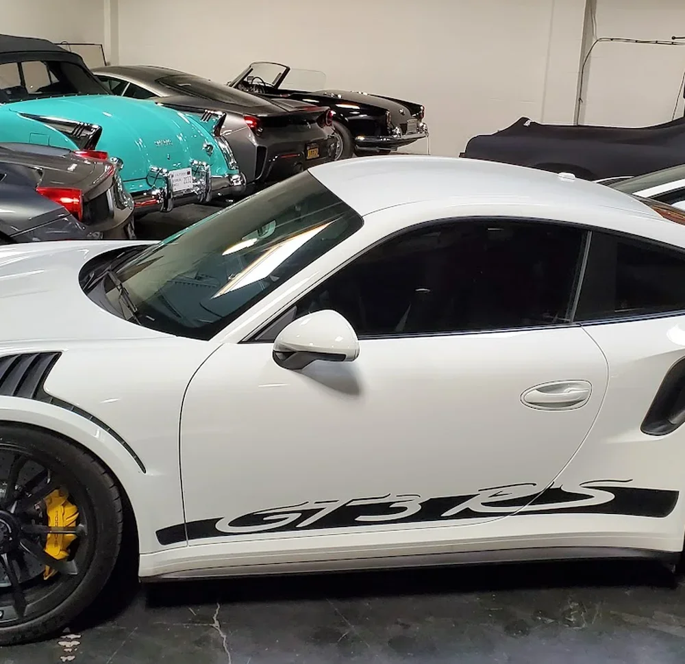 Porsche 911 GT3 RS among other vehicles at SV Collisions auto body shop in El Cajon